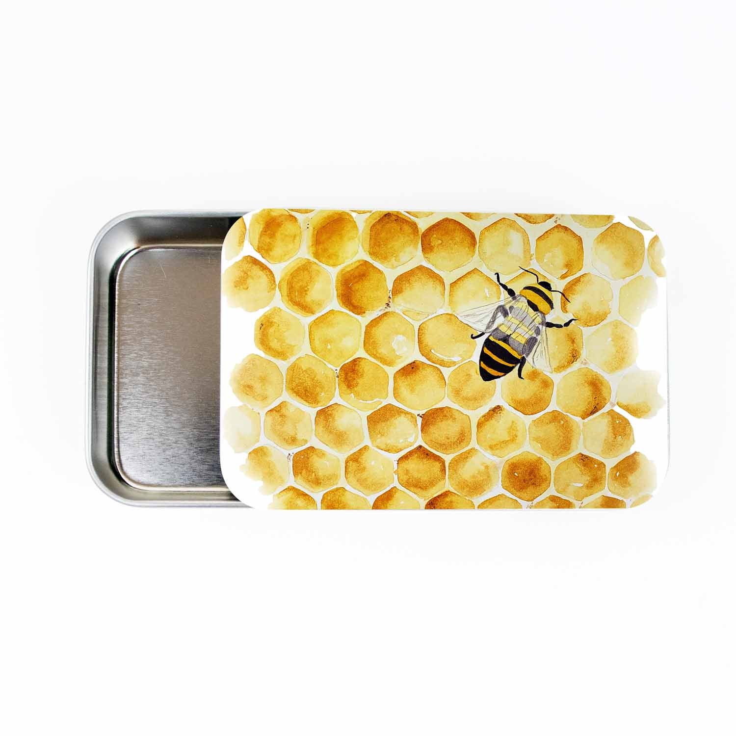 Honey Bee stitch marker storage tin, large slide-style tin open to show the empty metal tray, lid painted with watercolor honeycomb and a single bee