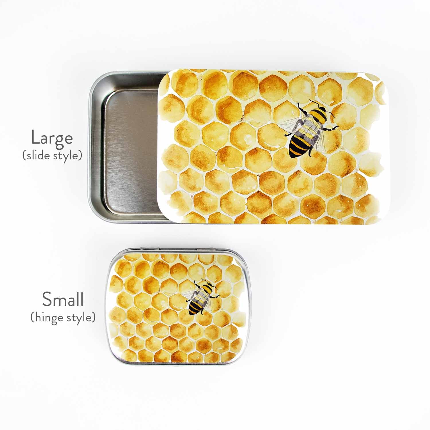 Honey Bee stitch marker storage tins shown together for size: large slide-style tin and small hinge-style tin, both with watercolor honeycomb and bee artwork