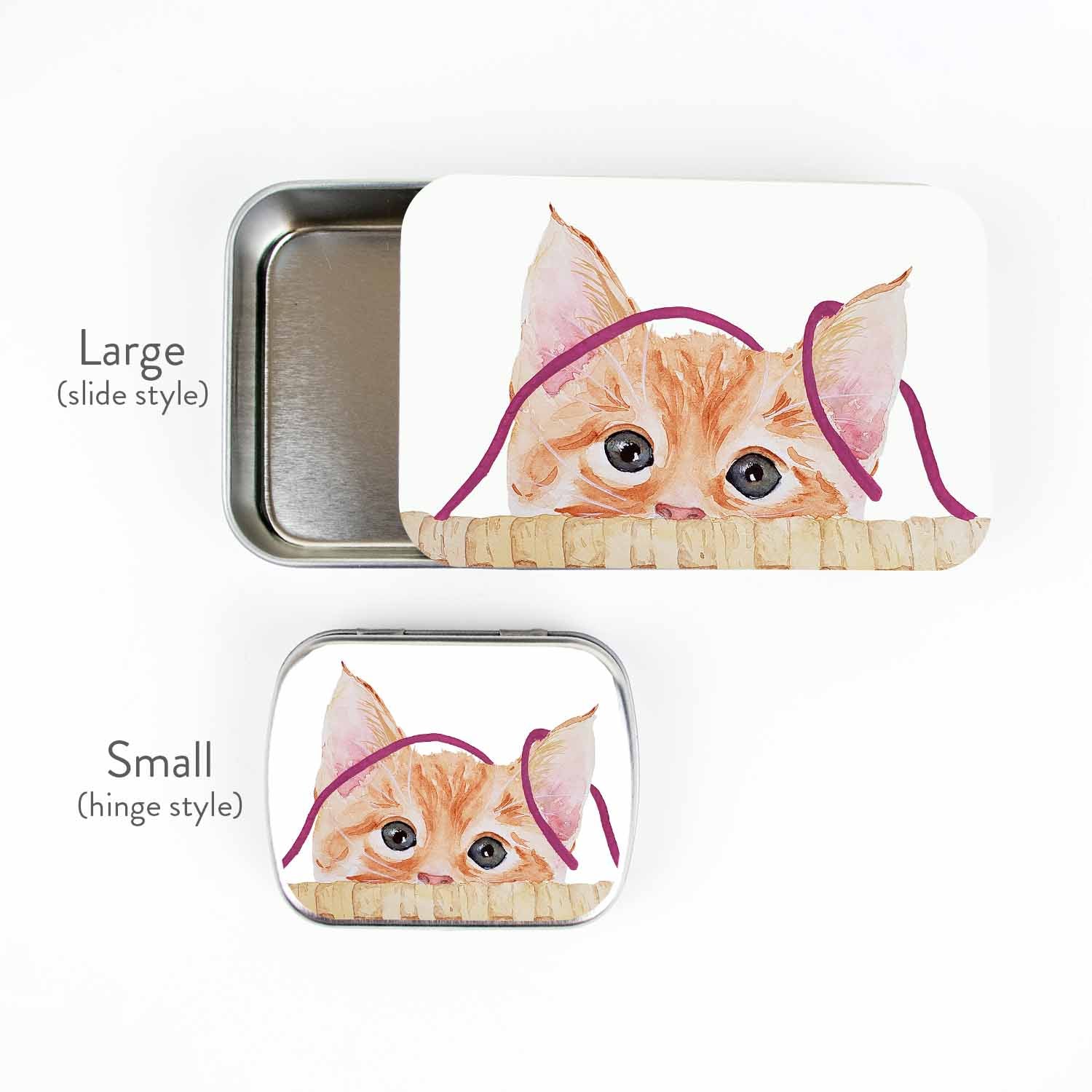 Kitten stitch marker storage tins shown together for size: large slide-style tin and small hinge-style tin with watercolor peeking kitten artwork