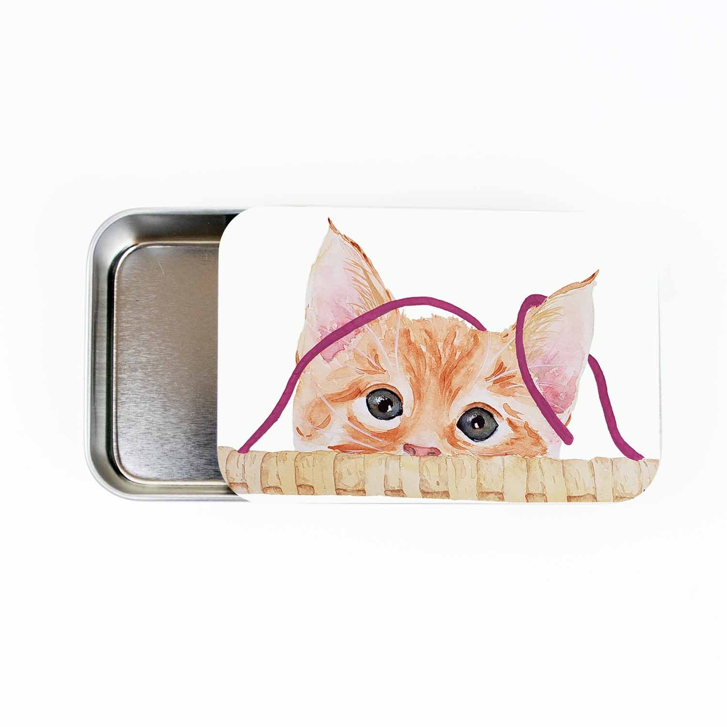 Kitten stitch marker storage tin, large slide-style tin open to show the empty metal tray, lid painted with a watercolor orange kitten peeking over a basket
