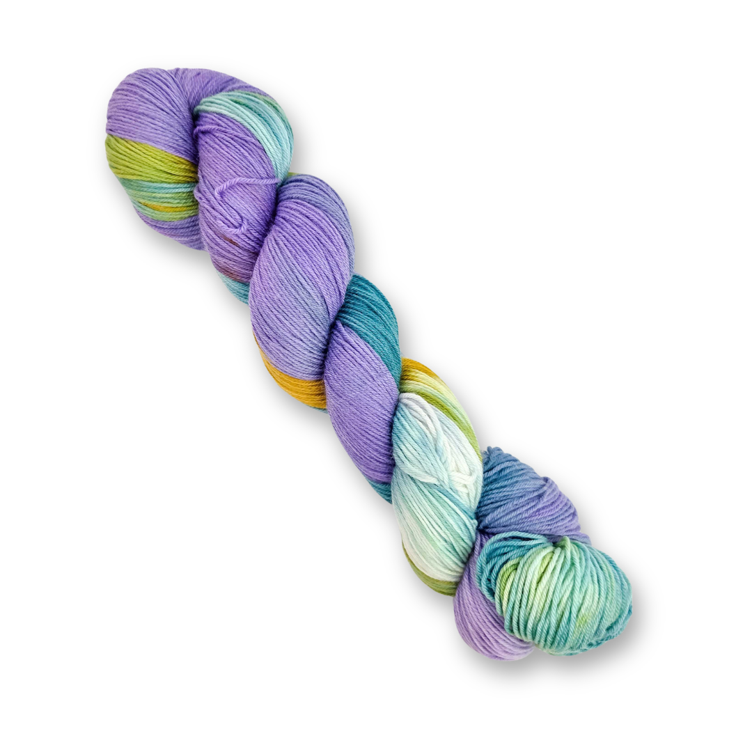 Molly Klein Design Cove sock yarn skein shown at an angle, variegated lavender, mint, teal and gold