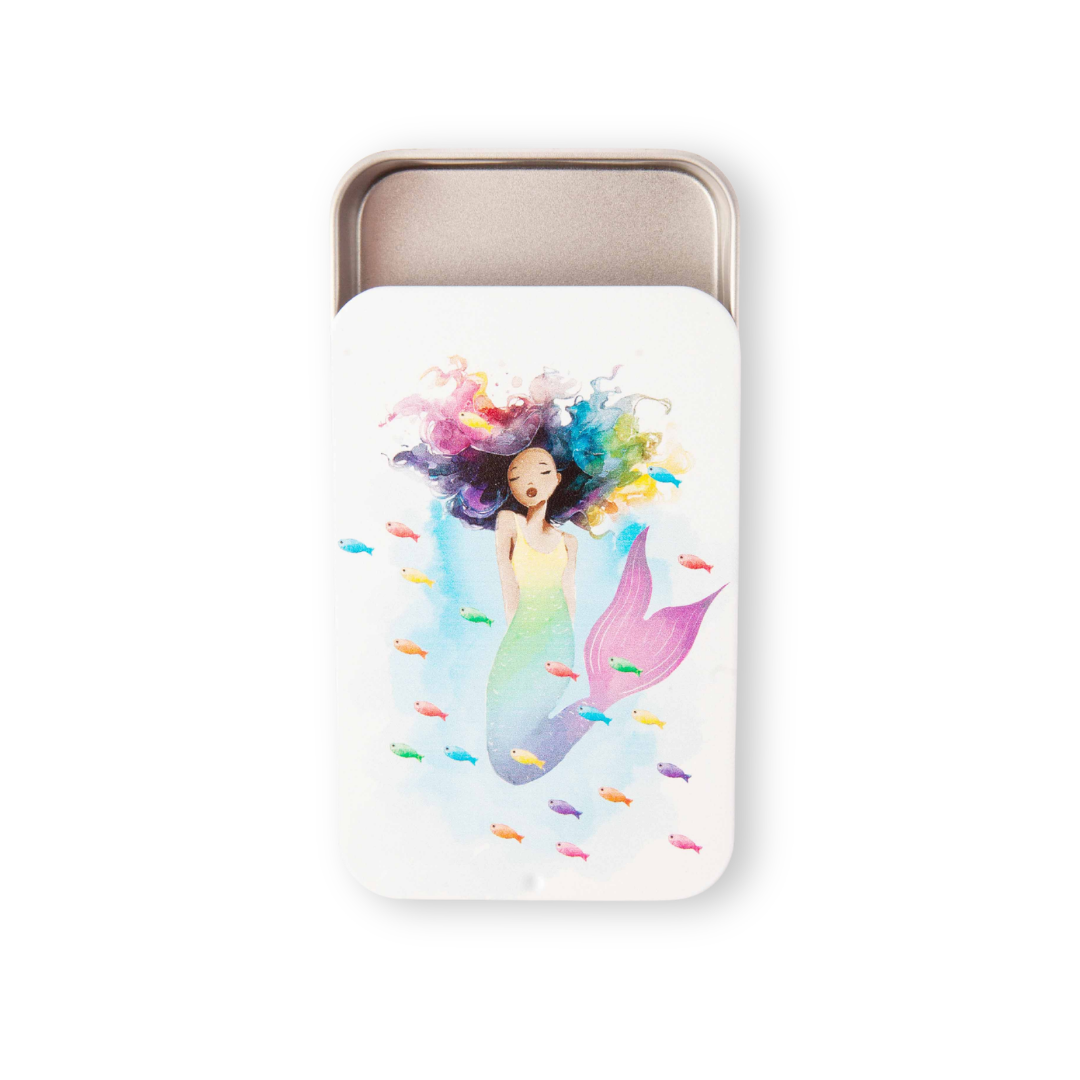 Silver notions storage tin with watercolor mermaid illustration surrounded by colorful fish from the 2026 Mermaid Summer Box