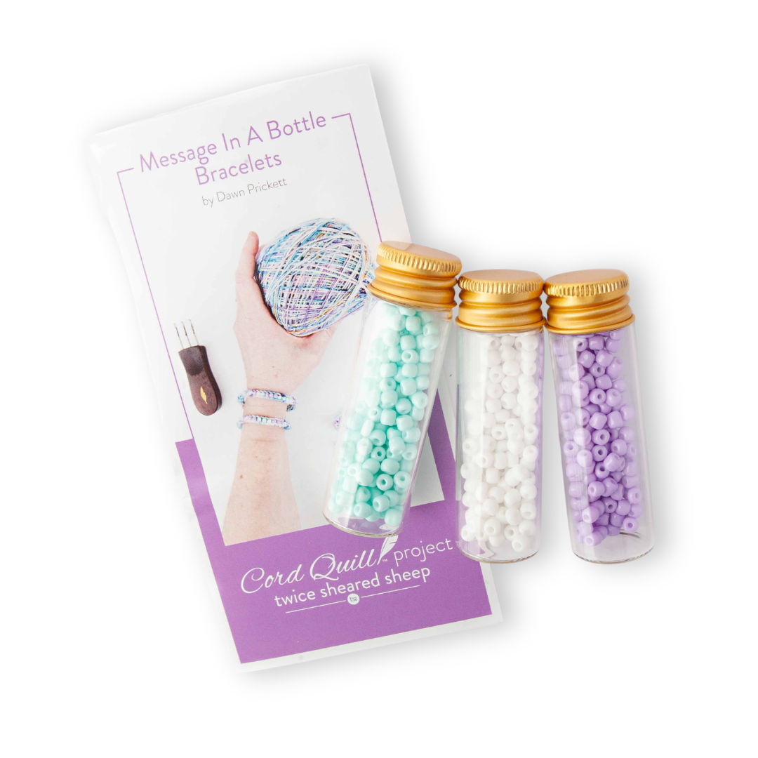 Message In A Bottle Bracelets Cord Quill project kit with instruction card and three bottles of mint, white, and lavender beads from the 2026 Mermaid Summer Box