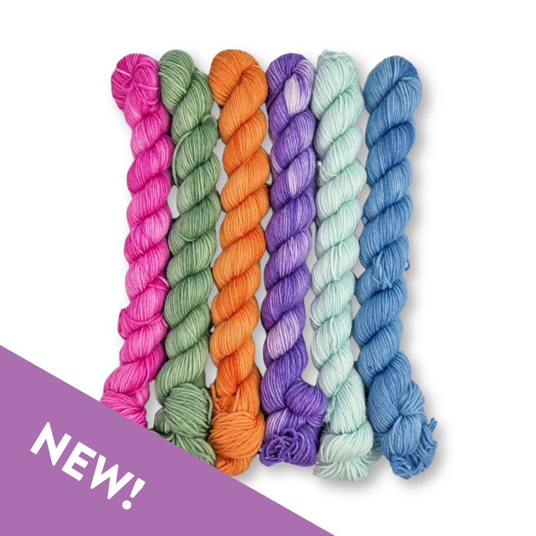 Set of colorful yarn skeins on a white background with 'NEW!' label.