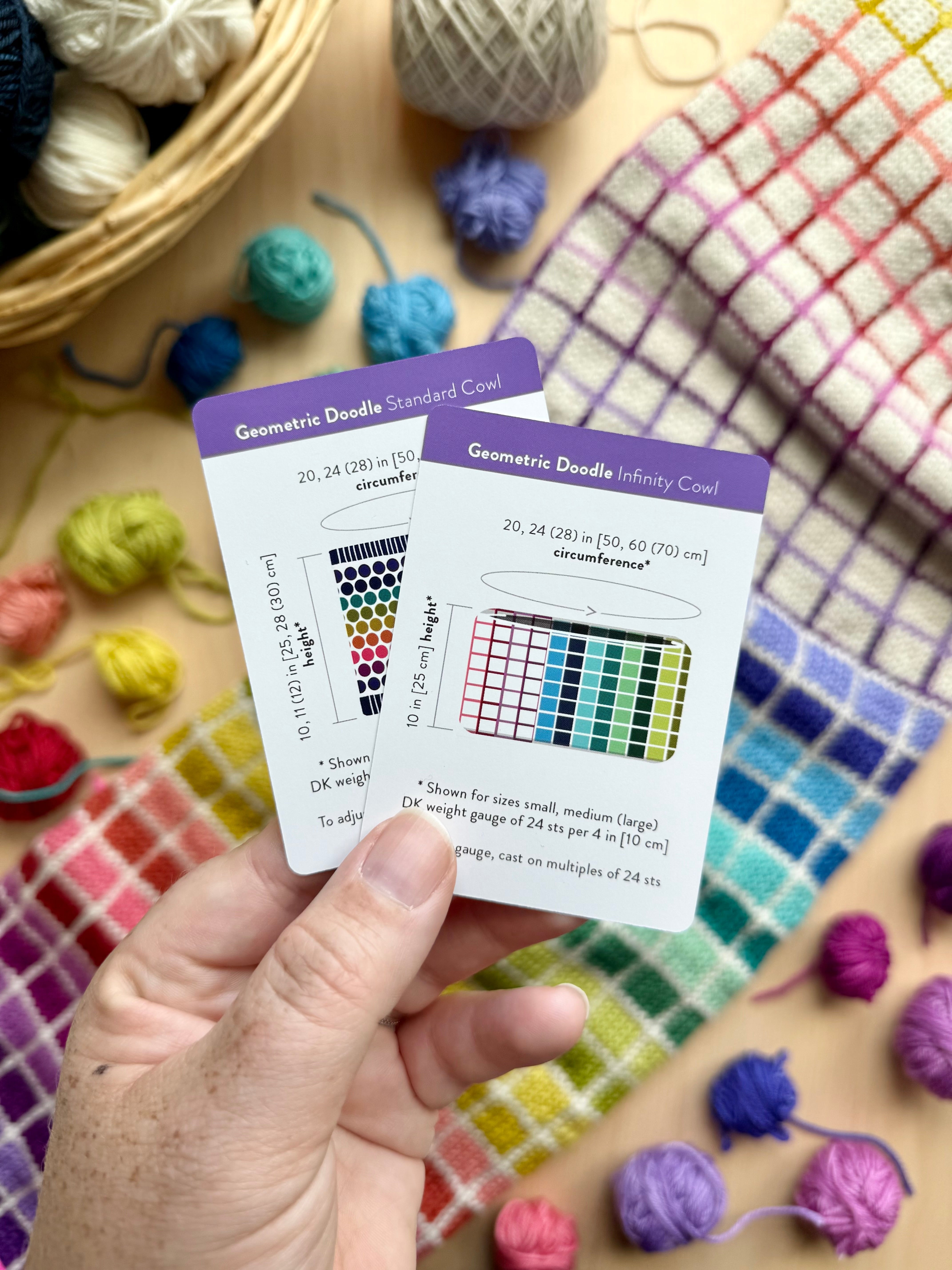 Hand holding the Geometric Doodle Standard Cowl and Infinity Cowl schematic cards