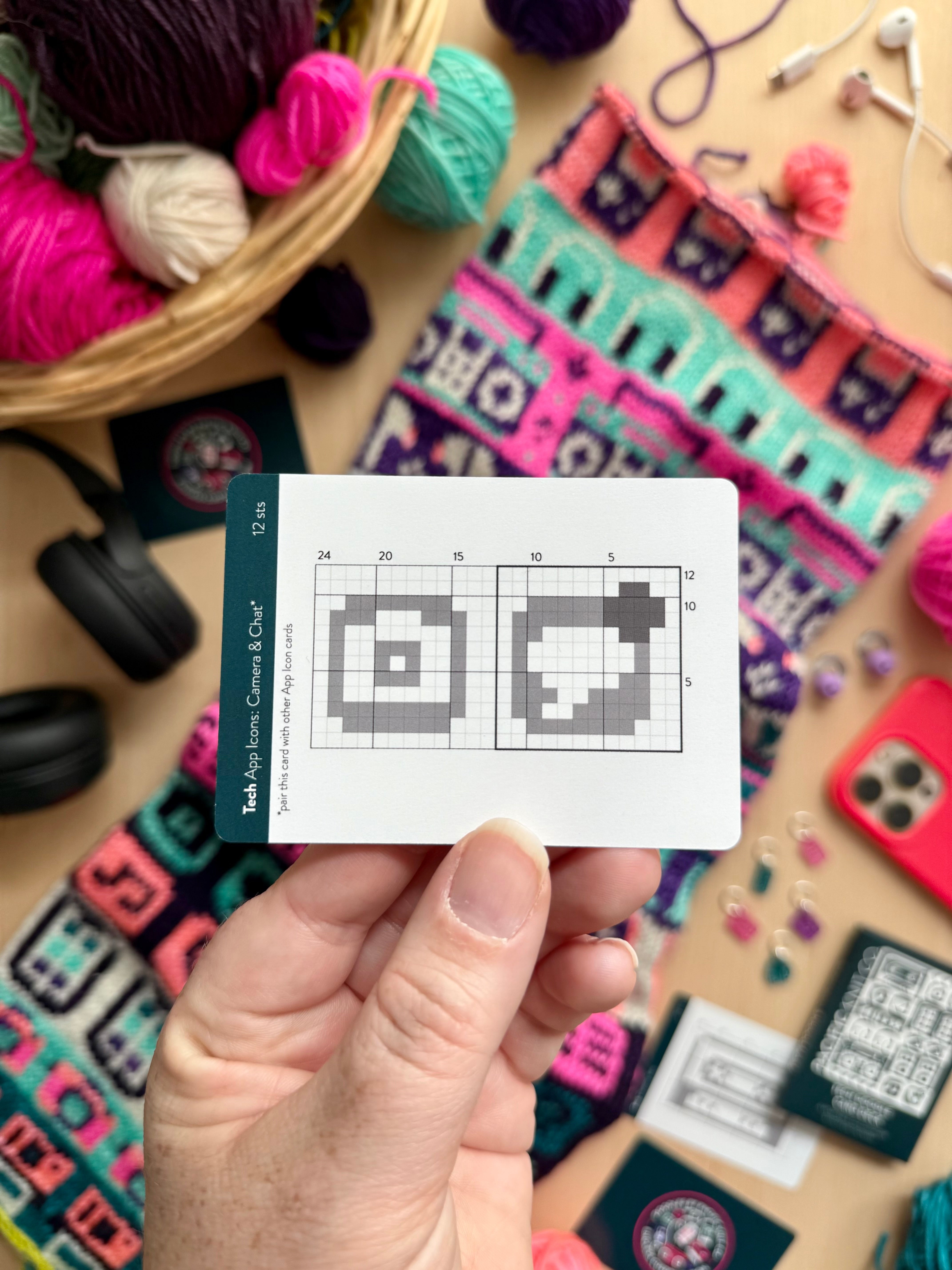 Hand holding a Tech Doodle app icons colorwork chart card