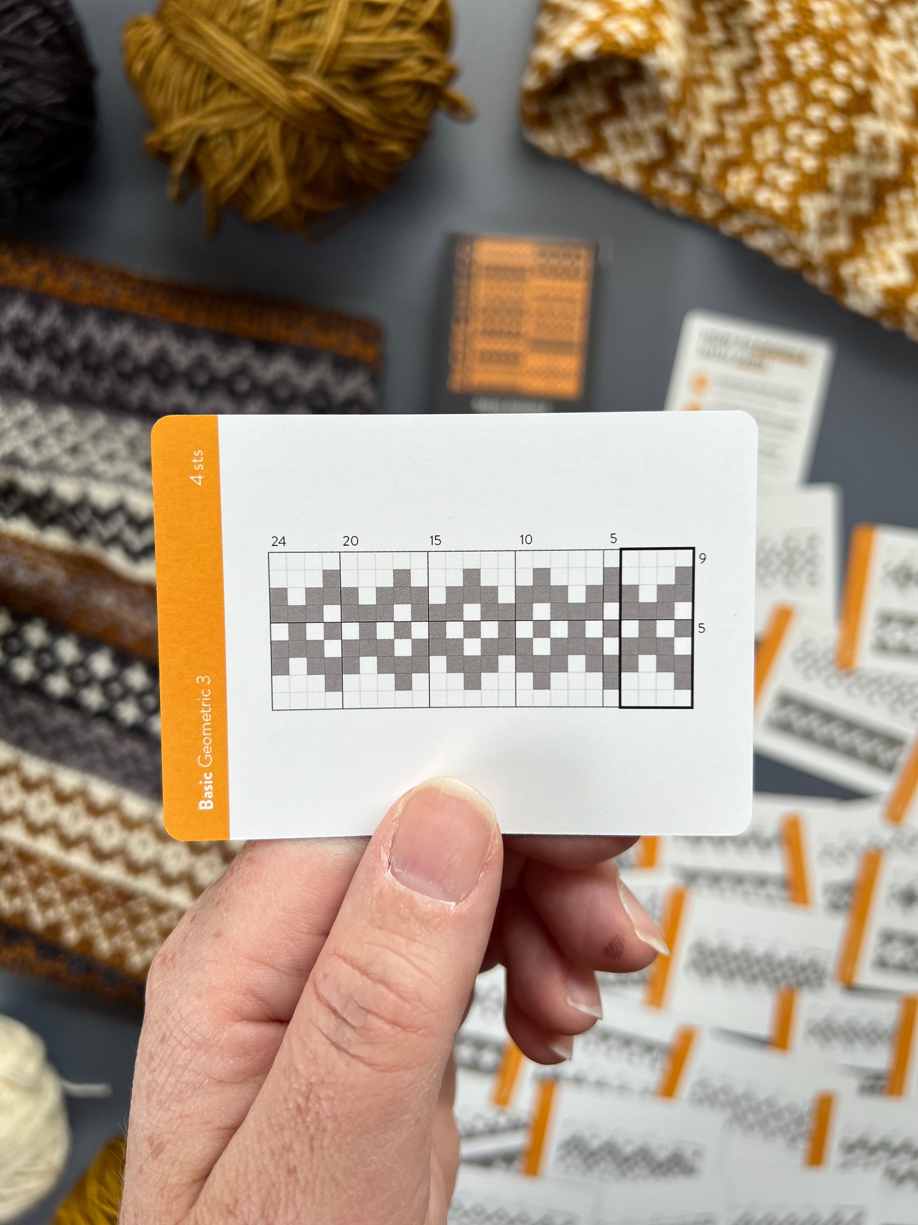 Hand holding a Basic Doodle minimalist grid chart card