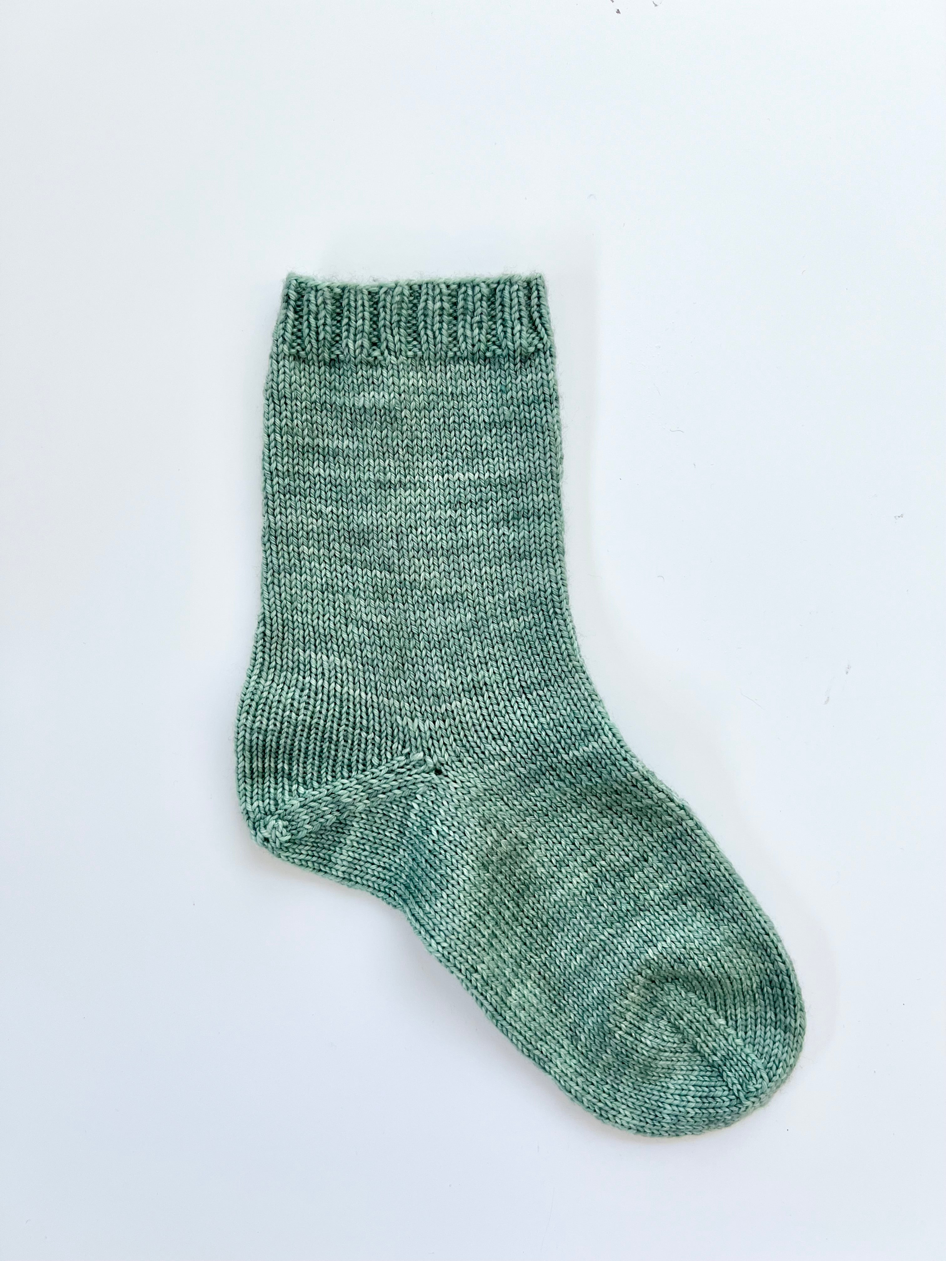 Sage green Base Doodle Top-Down Sock in fingering weight yarn
