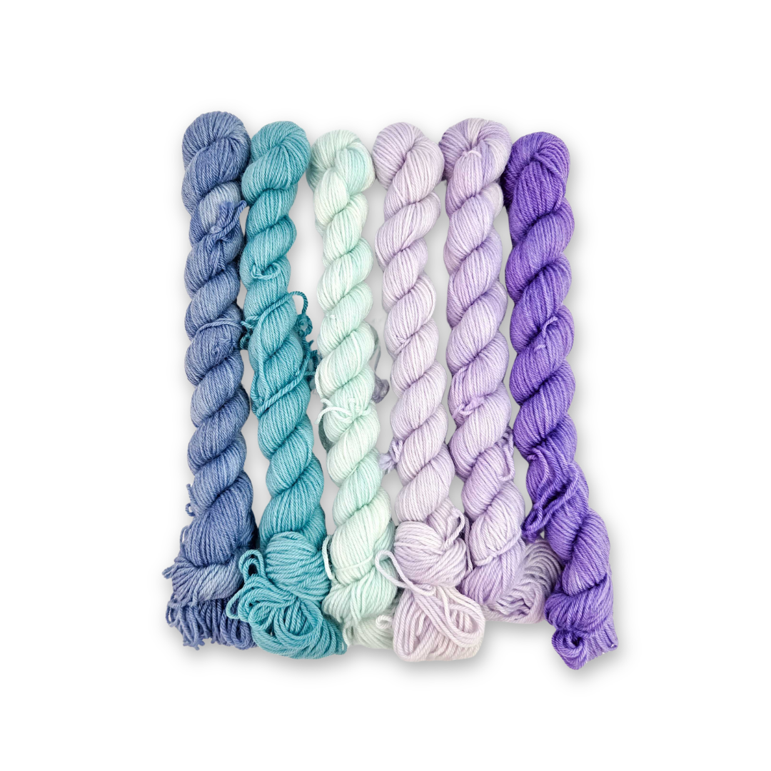 Molly Klein Design Mermaid Lagoon mini skein pack, six fingering weight sock yarn minis in blue, teal, mint, lavender and purple