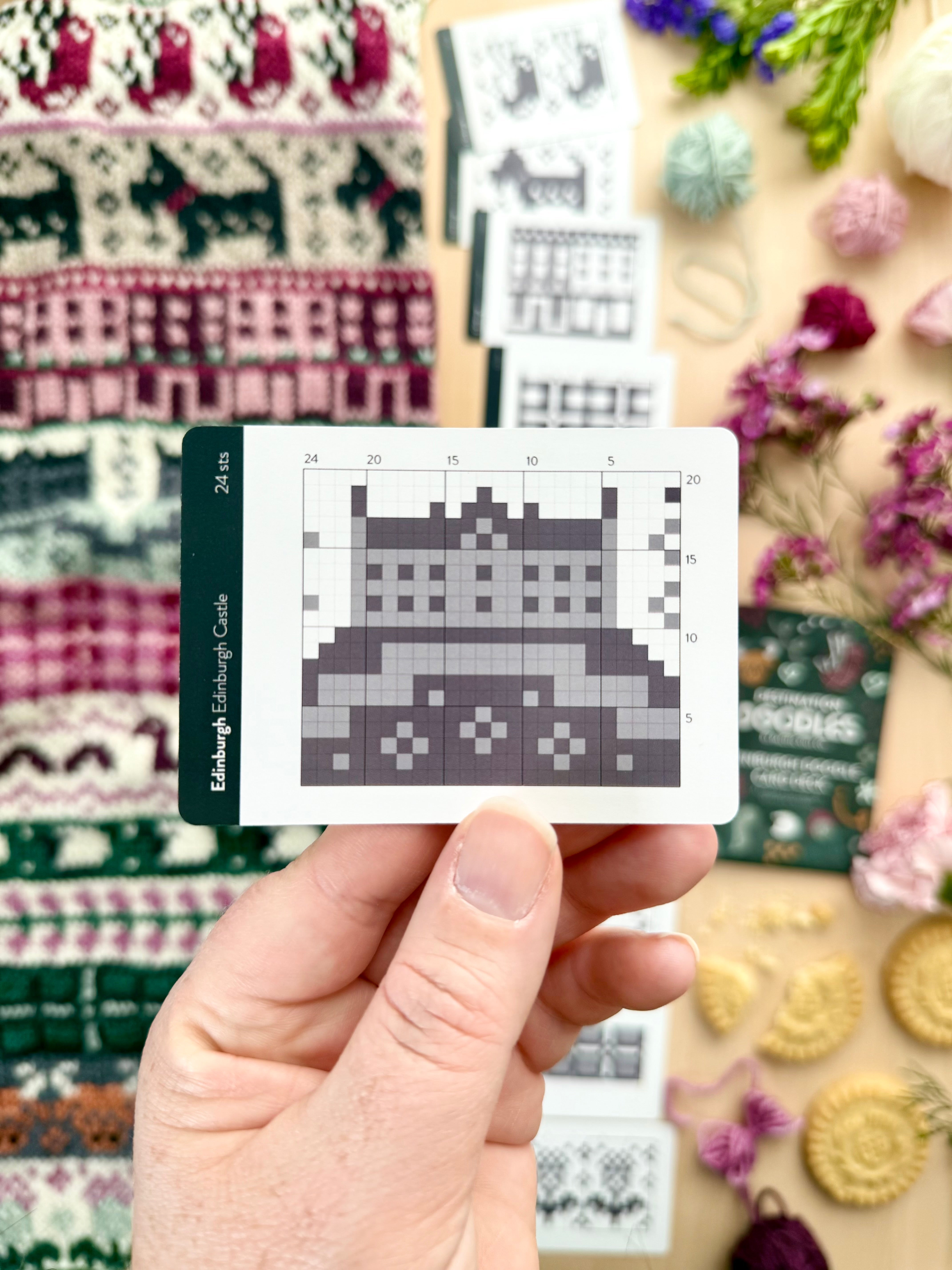 Hand holding an Edinburgh Doodle Edinburgh Castle colorwork chart card