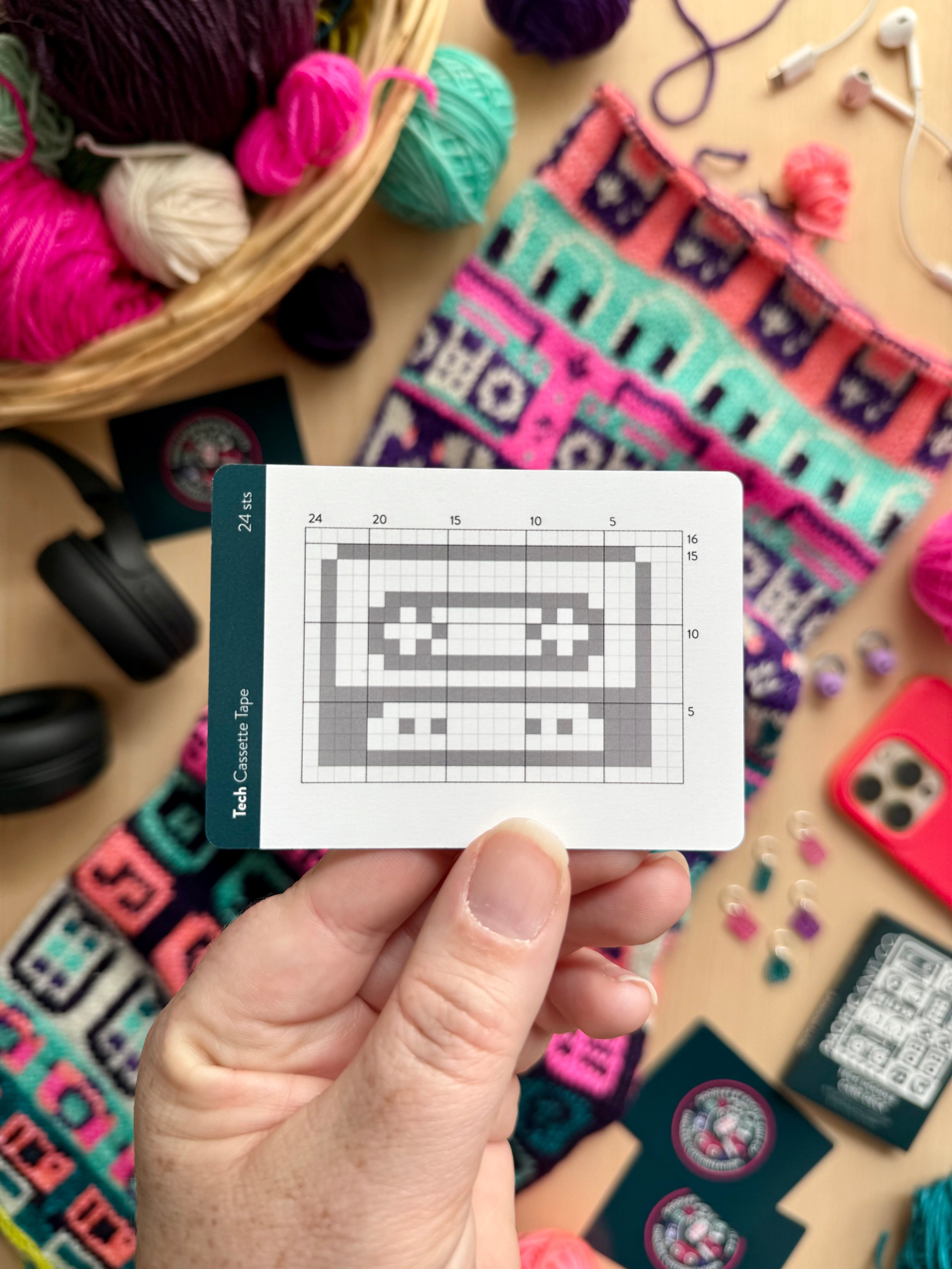 Hand holding a Tech Doodle cassette tape colorwork chart card