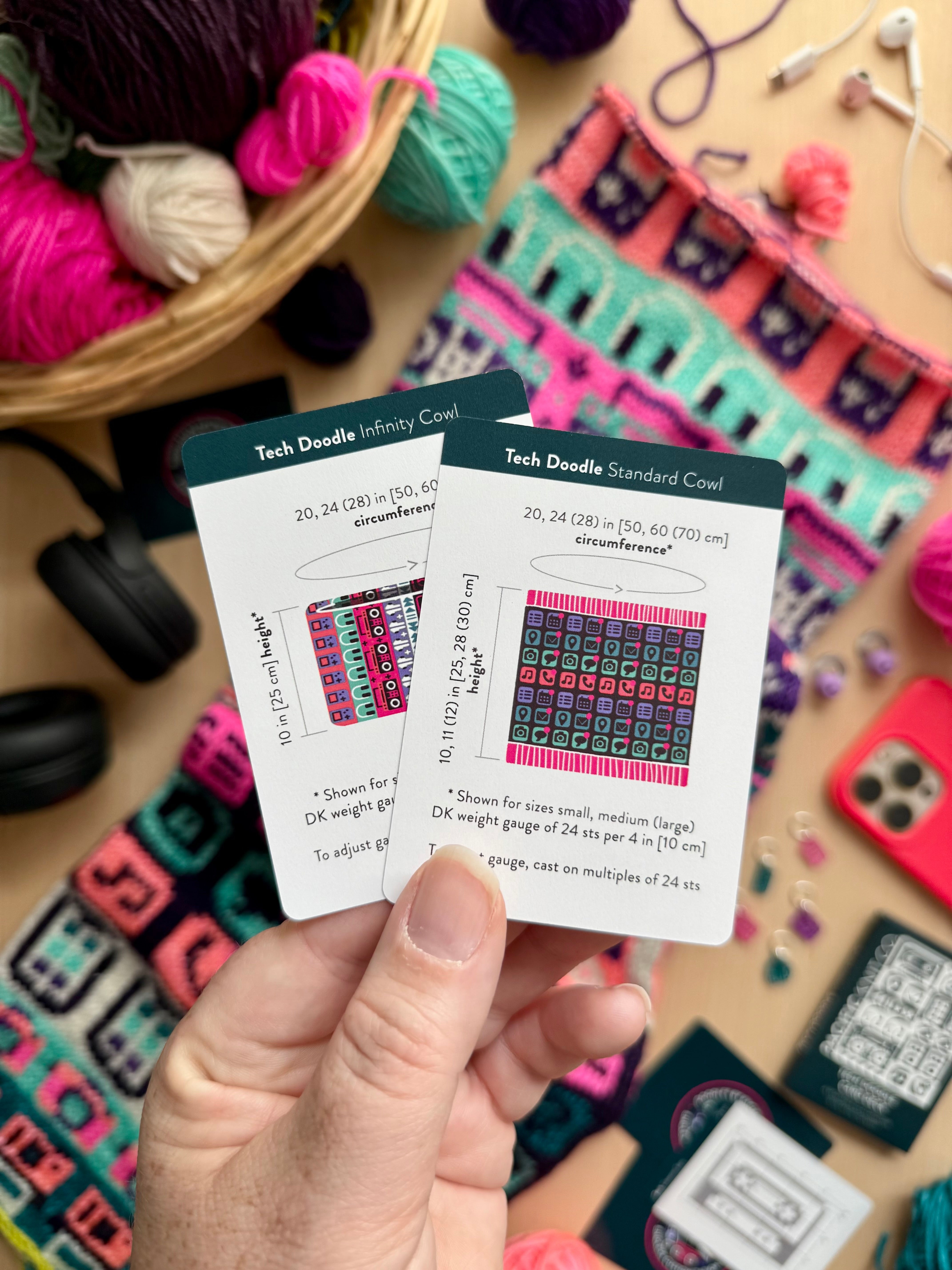Hand holding the Tech Doodle Infinity Cowl and Standard Cowl schematic cards