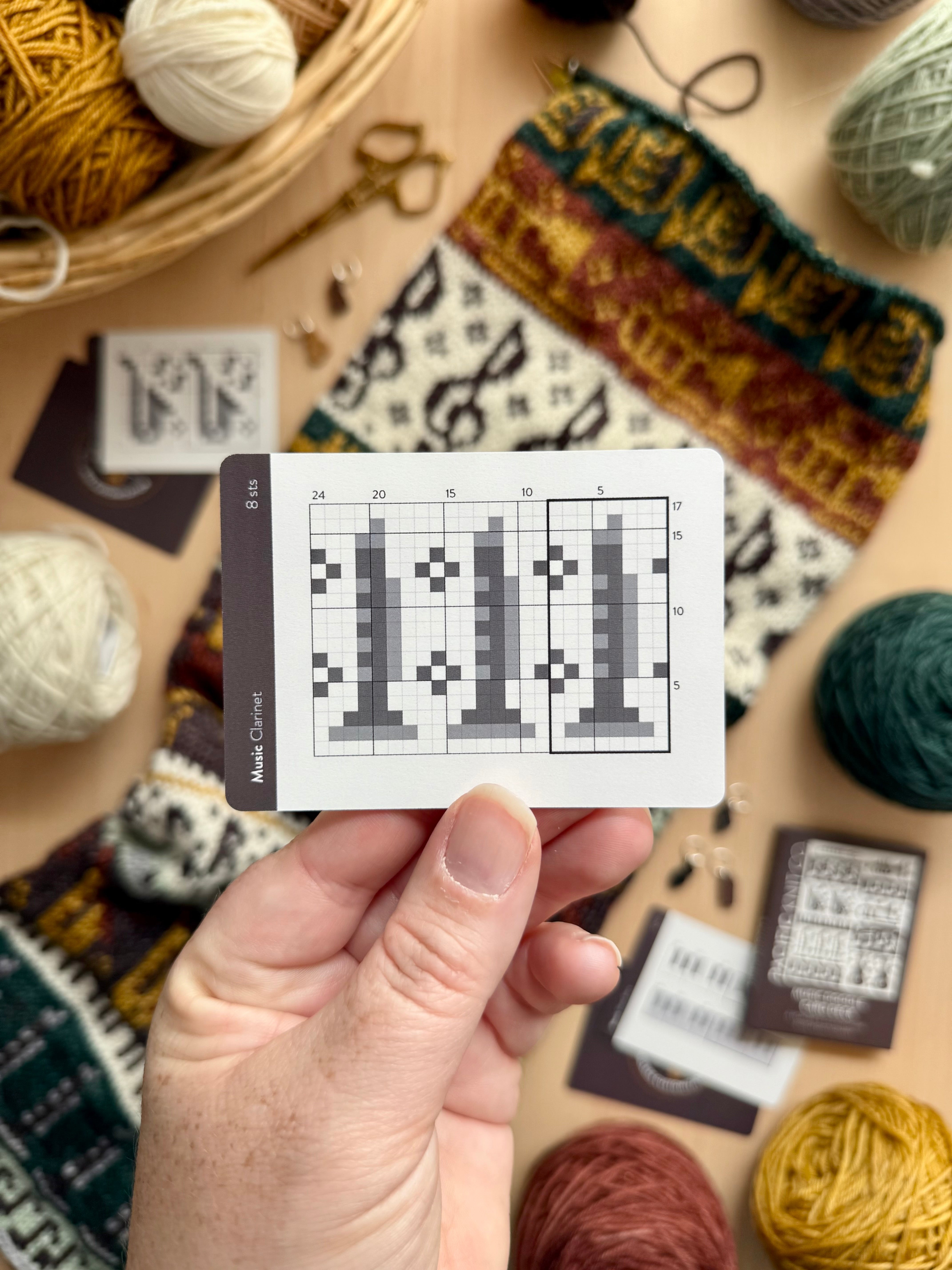 Hand holding a Music Doodle clarinet colorwork chart card