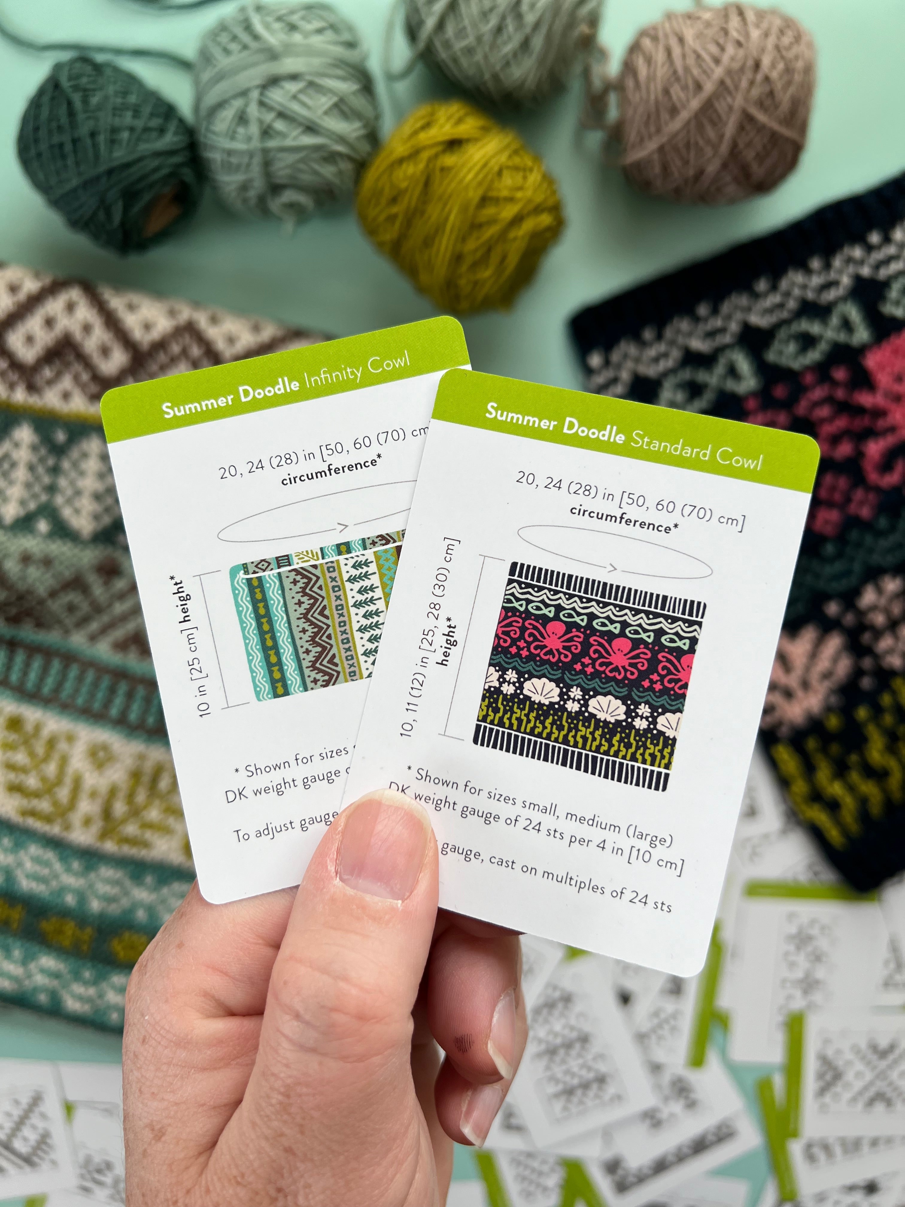 Hand holding the Summer Doodle Infinity Cowl and Standard Cowl schematic cards