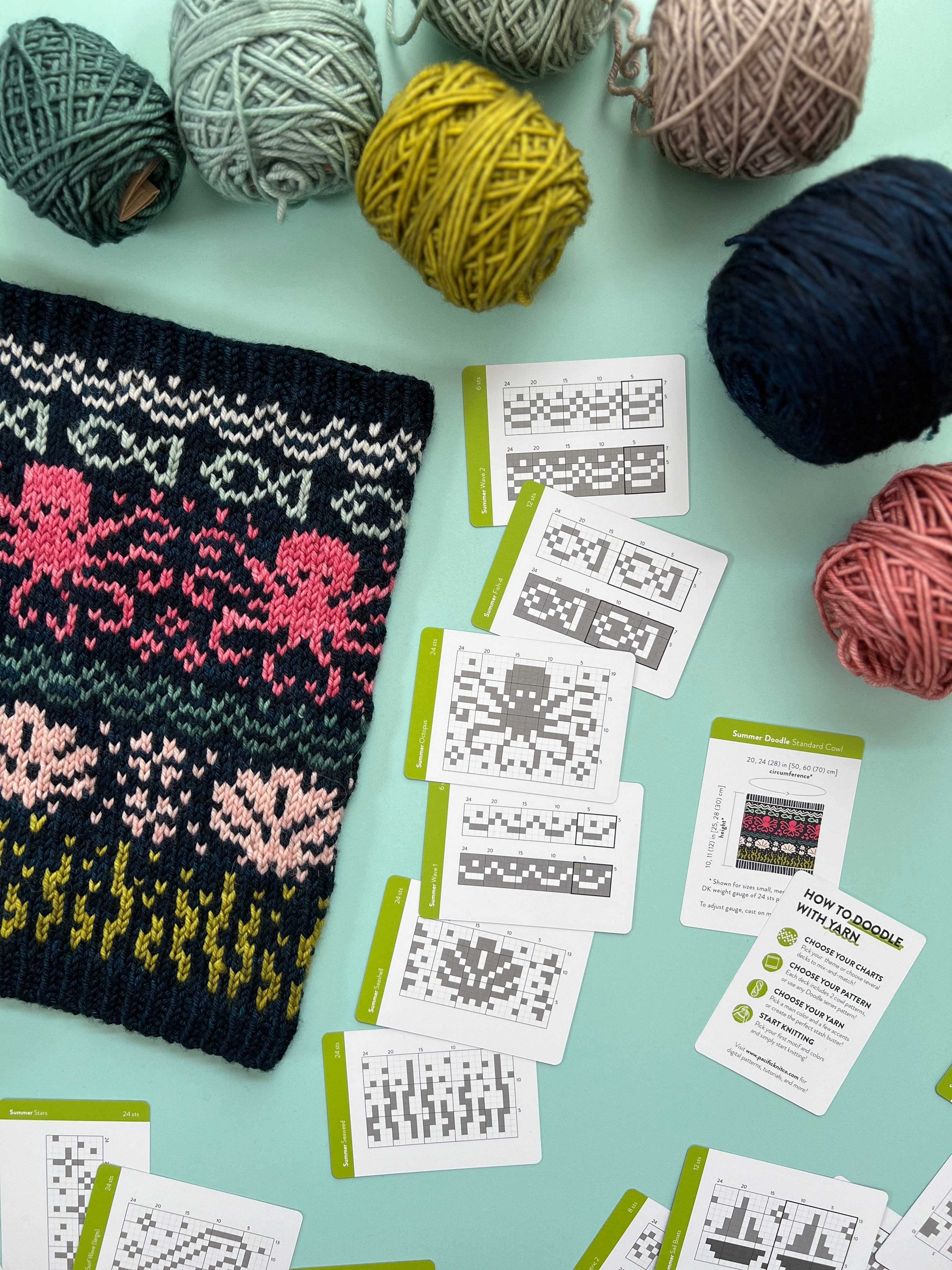 Navy Summer Doodle colorwork cowl with octopus and coral motifs beside chart cards