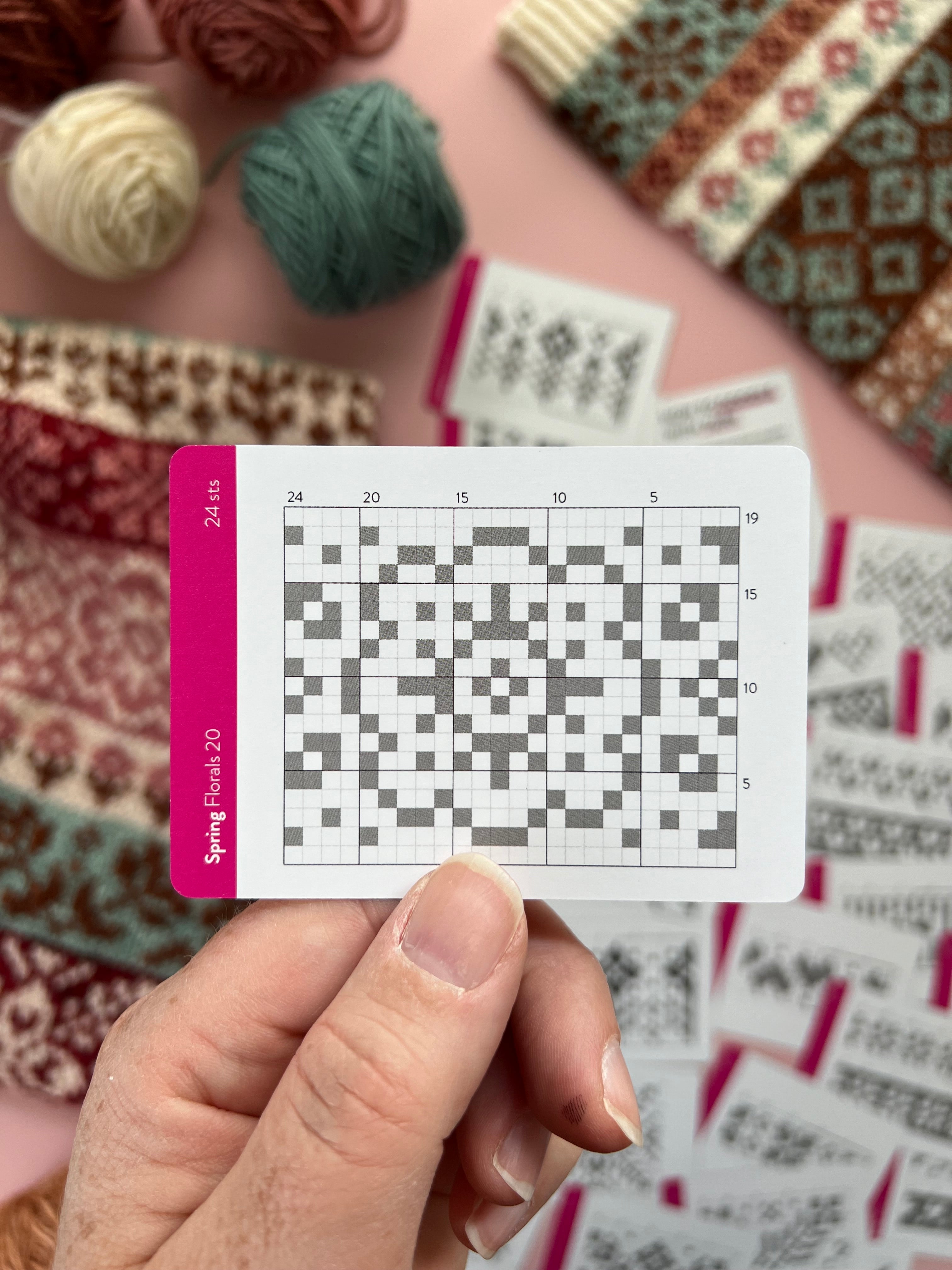 Hand holding a Spring Doodle floral colorwork chart card