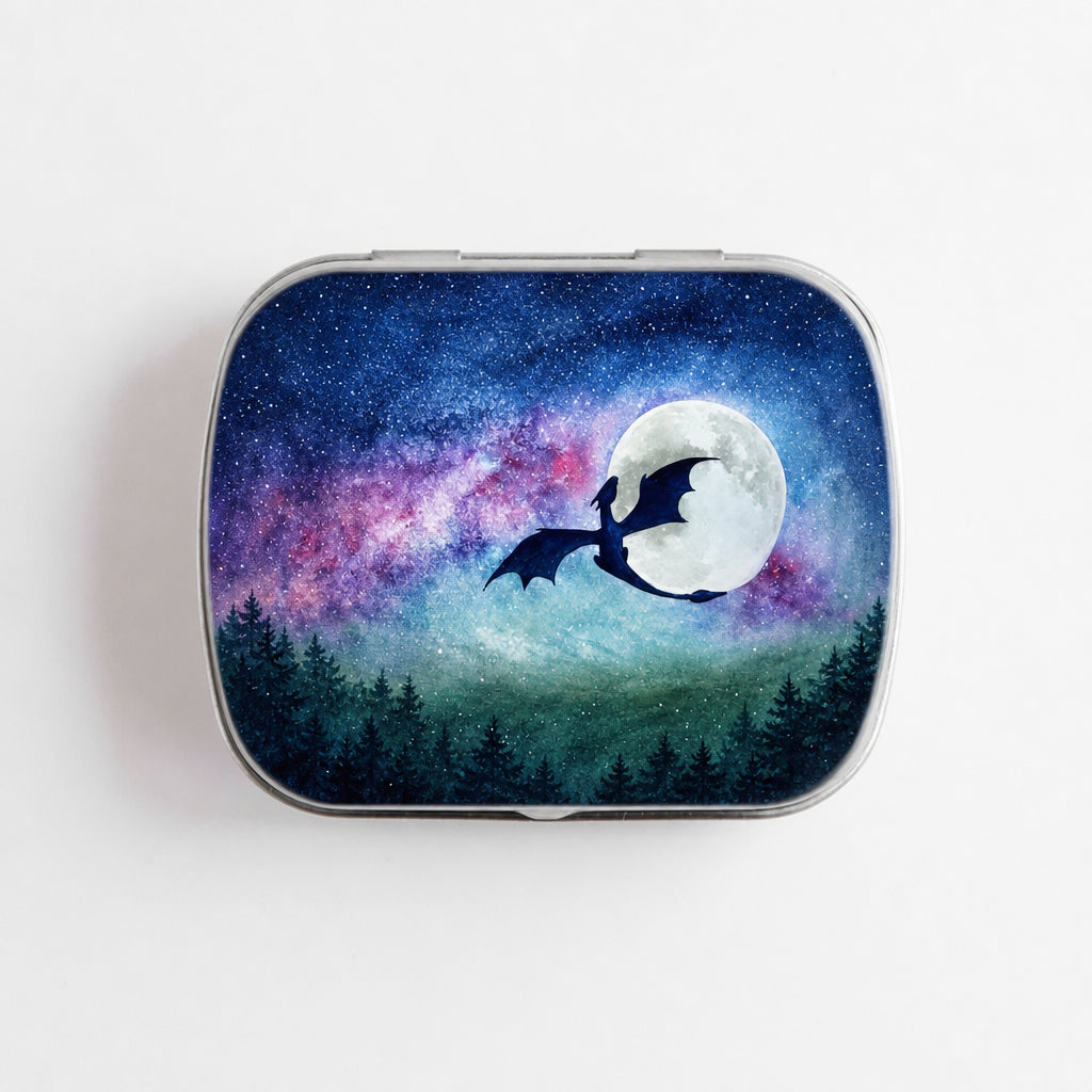 Small hinge-style Dragon Moon storage tin front view showing watercolor dragon silhouette flying past full moon against galaxy night sky with purple nebula and forest treeline