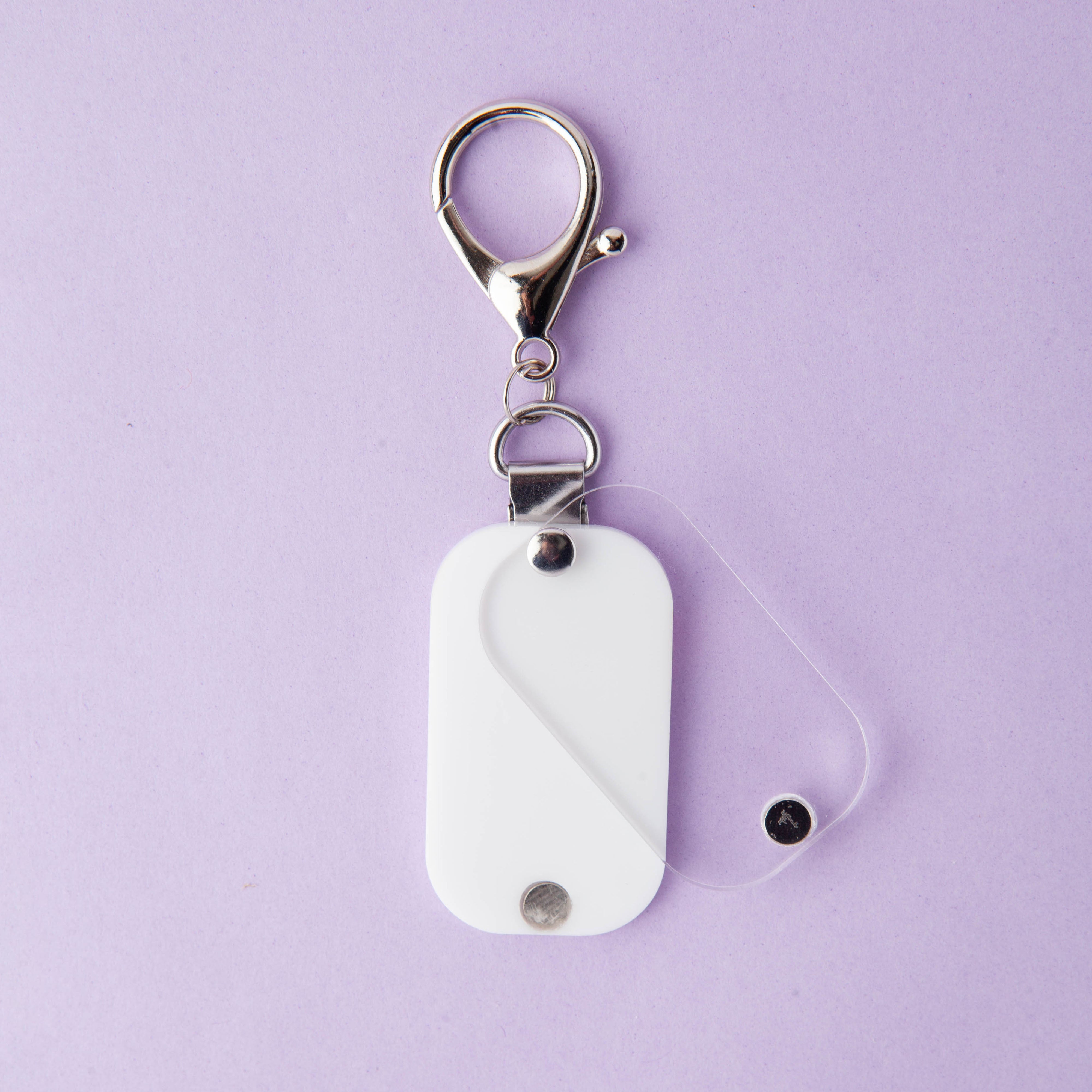 Remind Clip - White on purple background showing protective cover